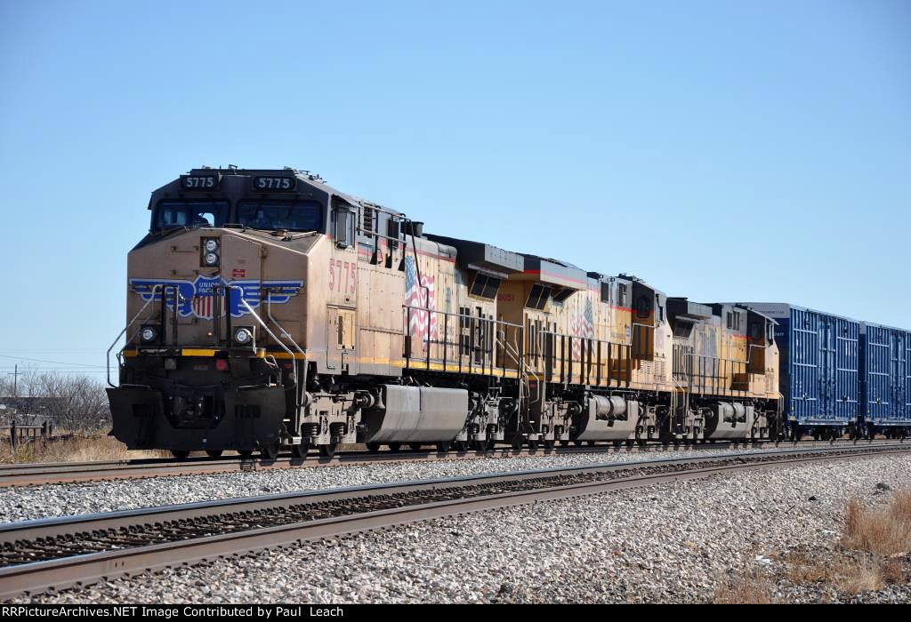 Paused westbound manifest waits in the siding